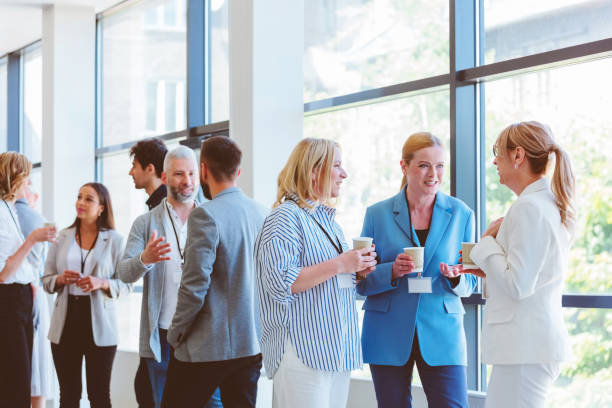 istock Business people in convention center during coffee break 1857507345