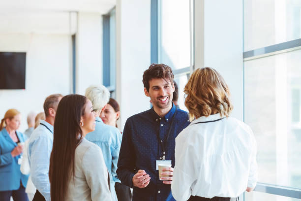 istock Business people in convention center during coffee break 1857507862