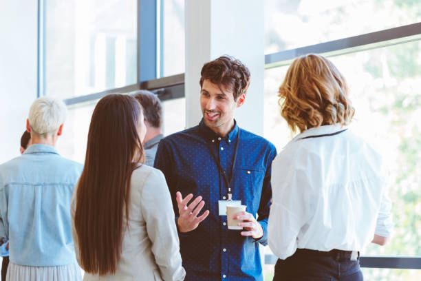 istock Business people in convention center during coffee break 1857508393