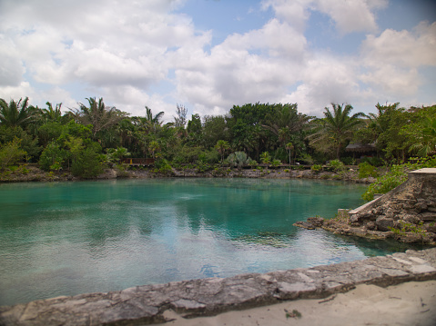 natural pool with turquoise water in chankanaab beach park in quintana roo, mexico