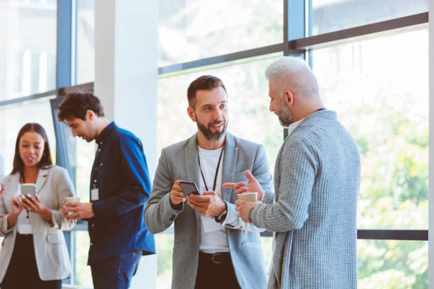istock Business people in convention center during coffee break 1857509420