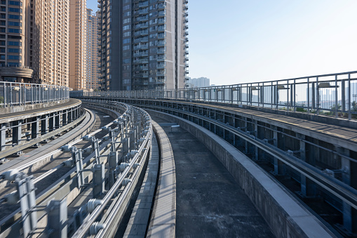 Photo of the track of modern urban high-speed trains traveling in residential areas