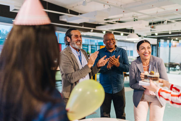 istock Coworkers celebrating birthday together in the office 1857531496