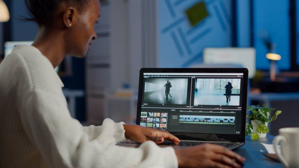 istock African videographer working at laptop from office editing video project 1857533122