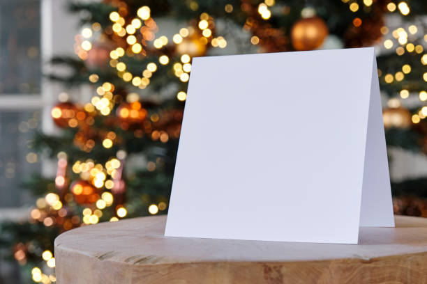istock Standing blank greeting card mockup in front of a christmas tree 1857536321