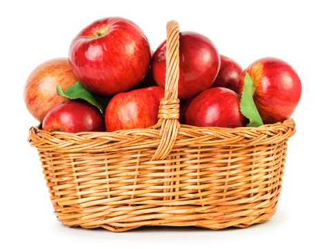 Fresh ripe apples in basket isolated on white background