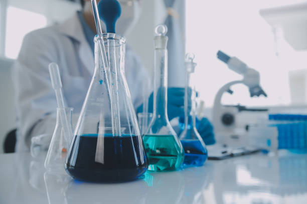 istock biochemical research scientist team working with microscope for coronavirus vaccine development in pharmaceutical research labolatory, selective focus 1857551639