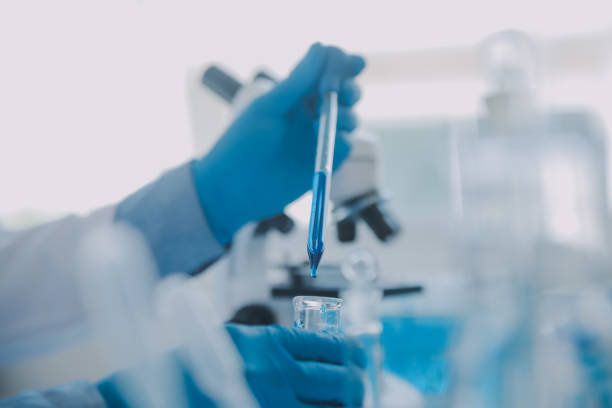 istock biochemical research scientist team working with microscope for coronavirus vaccine development in pharmaceutical research labolatory, selective focus 1857556934