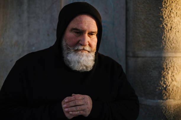 Desperate mature man praying to God