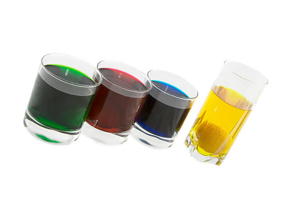 istock Three glasses with multi-coloured cocktails isolated over white 185756818