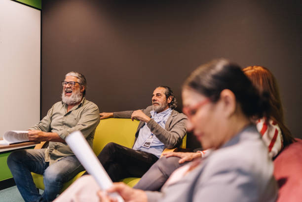 istock Coworkers talking in the office 1857575909