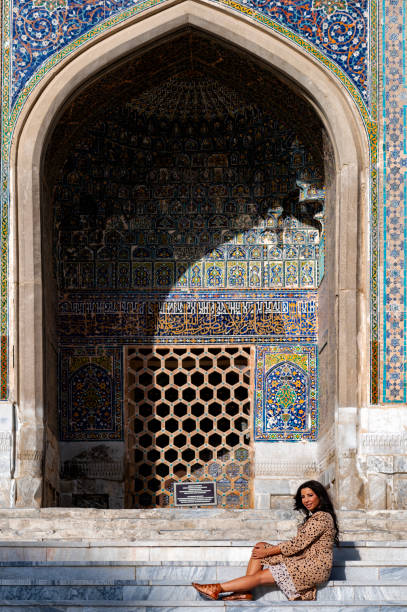 istock Lady posing in the Ulugh Bek Madrassah, Ragistan Square, Samarkand 1857625120