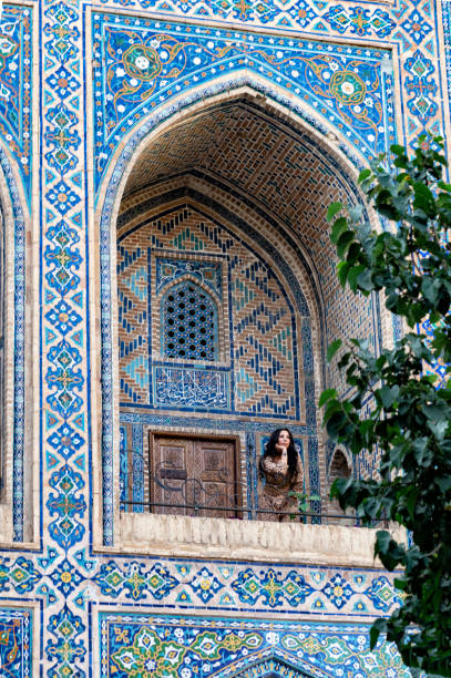 istock Lady posing in the Ulugh Bek Madrassah, Ragistan Square, Samarkand 1857628727