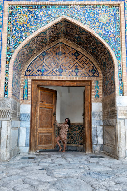 istock Lady posing in the Ulugh Bek Madrassah, Ragistan Square, Samarkand 1857632374