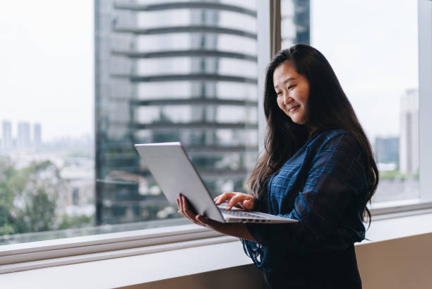 istock Mature businesswoman using laptop in the office 1857637563