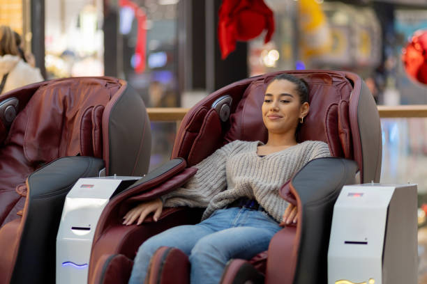 istock Woman relaxing in massage chair 1857640747