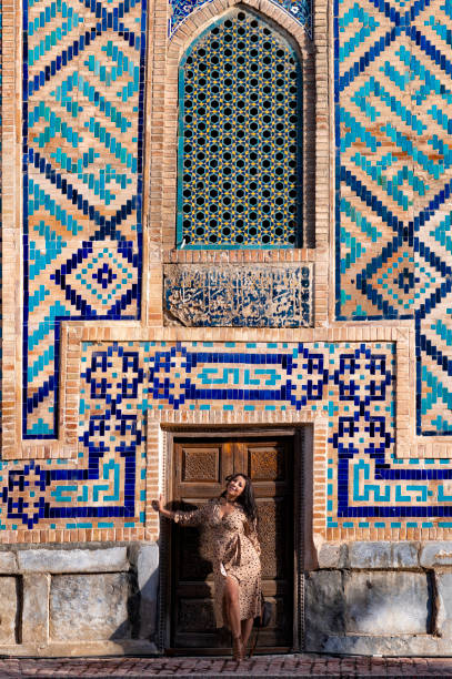 istock Lady posing in the Ulugh Bek Madrassah, Ragistan Square, Samarkand 1857642802