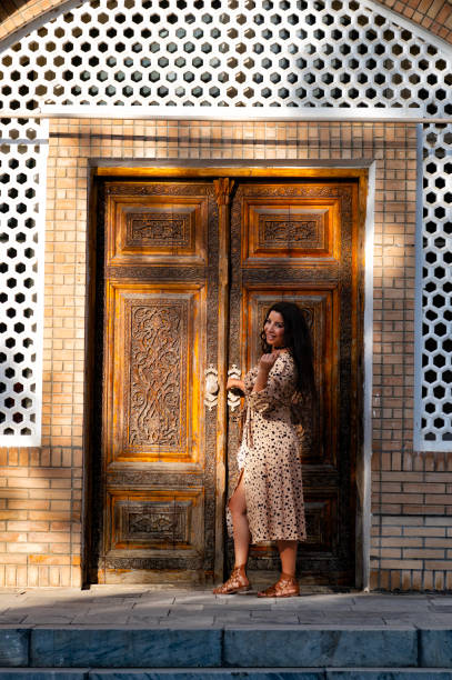 istock Lady posing in the Ulugh Bek Madrassah, Ragistan Square, Samarkand 1857644377