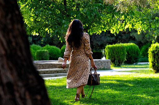A lady posing in the gardens of  Ragistan Square, Samarkand