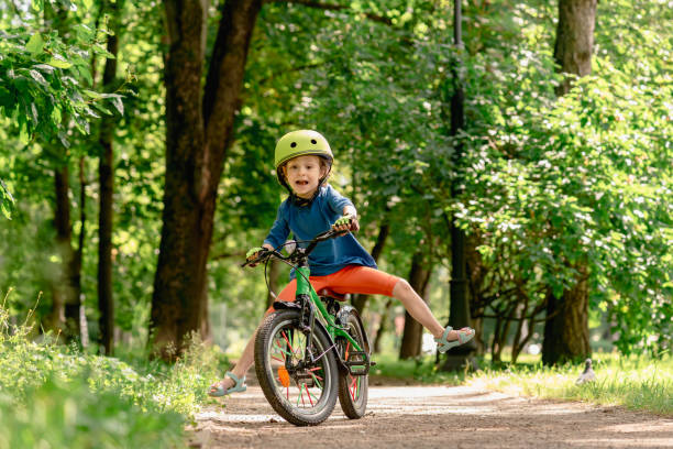 istock A child learning to ride a bicycle is unable to maintain balance and falls down. 1857671655