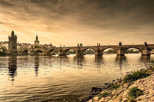 Prague - Charles bridge from the banks over the Vltava River in Czech Republic Czechia Europe