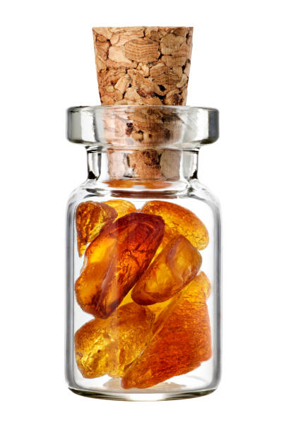 Yellow mineral amber in a small glass jar stock photo