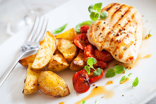 istock Grilled chicken breast with rosemary potatoes and cherry tomatoe 185771637