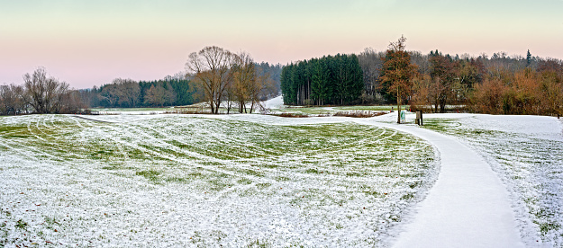 golf course at winter with snow and pathway in Bath Tatzmannsdorf in the region Burgenland, Austria