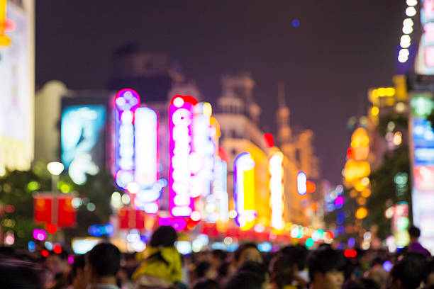 istock Defocused Crowded Street at Night 185773924