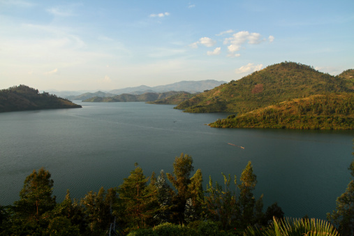 Lake Kivu set amongst rolling hills fading into the horizon in Rwanda, Africa