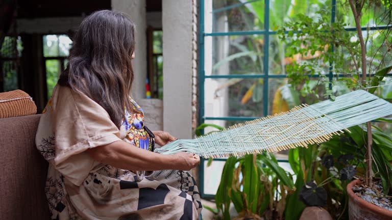 Indigenous senior woman making crafts