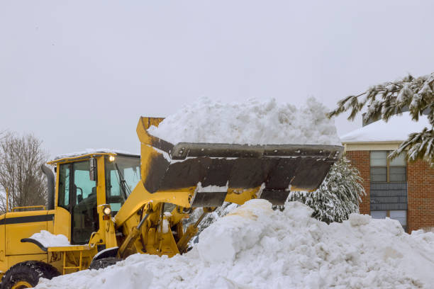 snowplow trucks remove snow from a parking lot after heavy snowfalls - snowplow snow parking lot pick up truck imagens e fotografias de stock