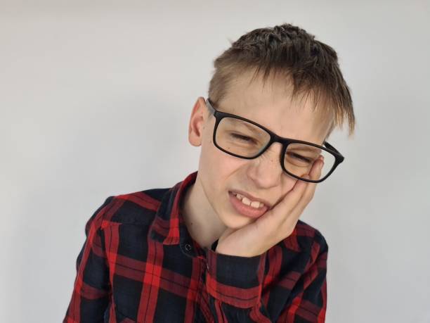 istock Teen boy with severe toothache 1857843328