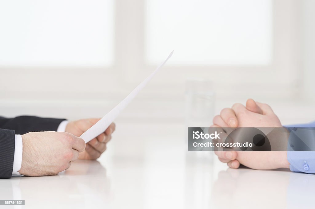 Interview. Close-up of two businesswoman around the table during job interview Adult Stock Photo