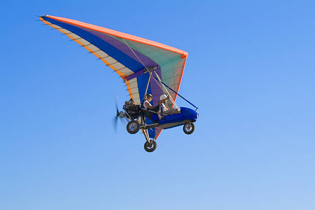 istock Extreme flight on deltaplane in a blue sky 185784926