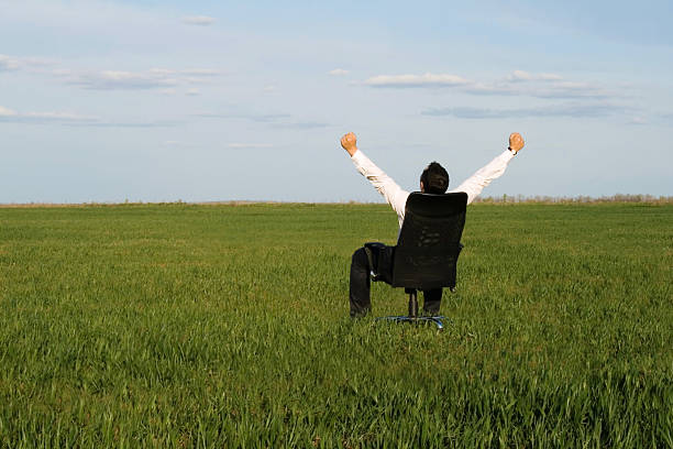 istock businessman take energy from nature 185786961