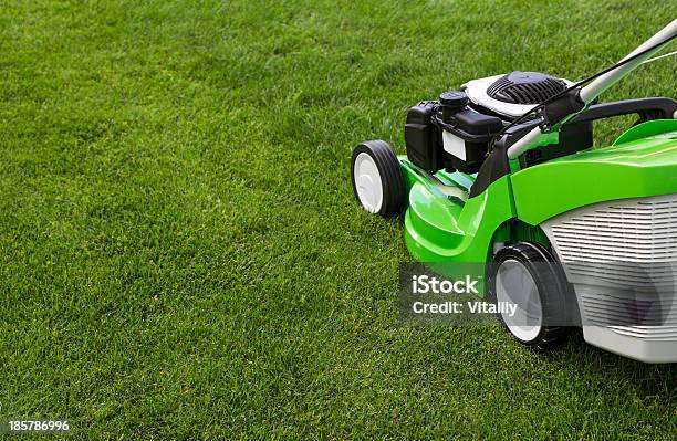 Green Lawnmower On The Lawn Stock Photo - Download Image Now - Black Color, Color Image, Cutting