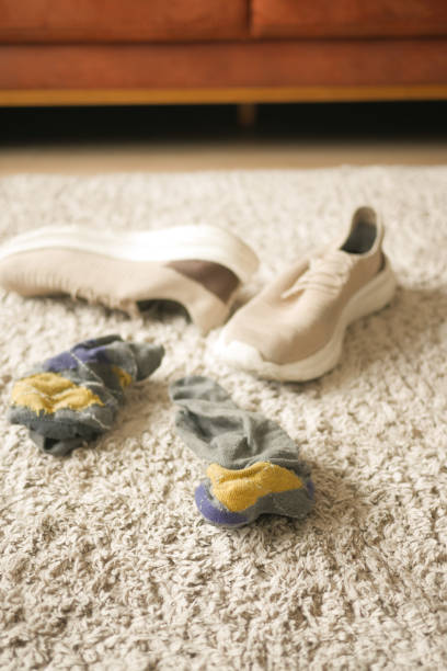 istock dirty sock and shoe on floor 1857881963
