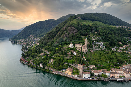 Aerial image of the parish church Madonna del Sasso stands on the high hill of Vico Morcote. Morcote at the Lake Lugano was once credited as one of the most beautiful Swiss villages.
