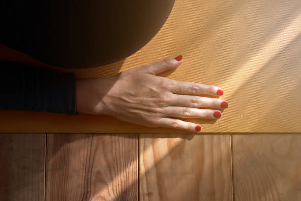 istock Crop woman performing exercise on floor 1857909008
