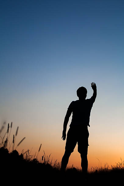 istock Silhouette of man standing in field 185791117