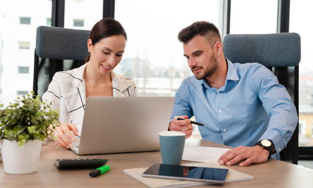 istock Business couple working in the office 1857931050