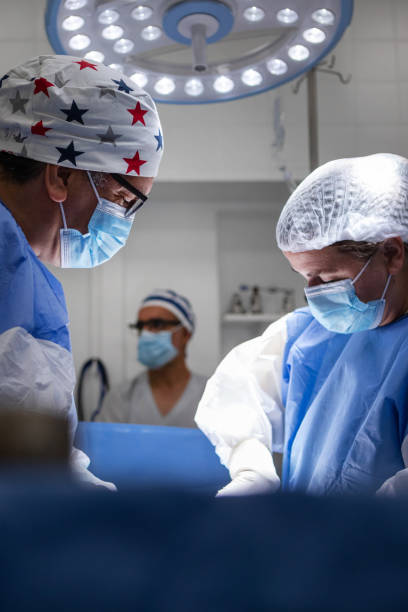 istock Doctors performing a cesarean section in the operating room 1857941165