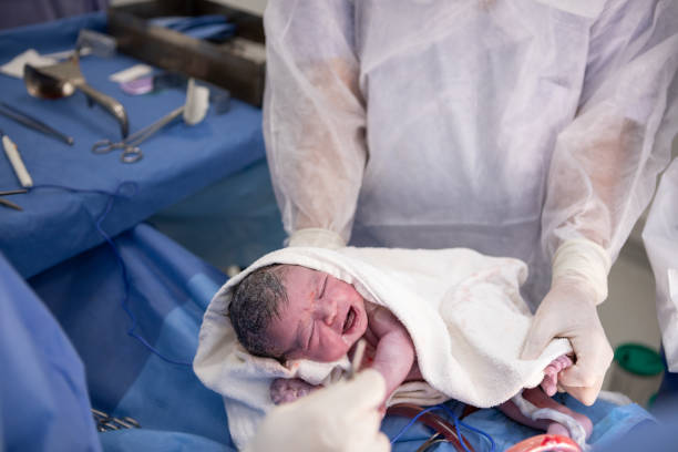 istock Newborn baby in a cesarean section 1857941302