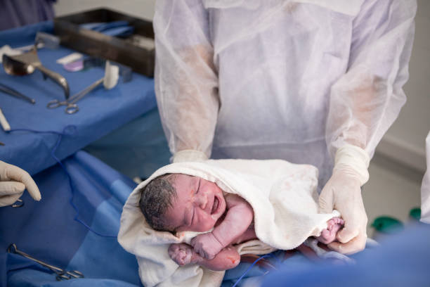 istock Newborn baby in a cesarean section 1857941305