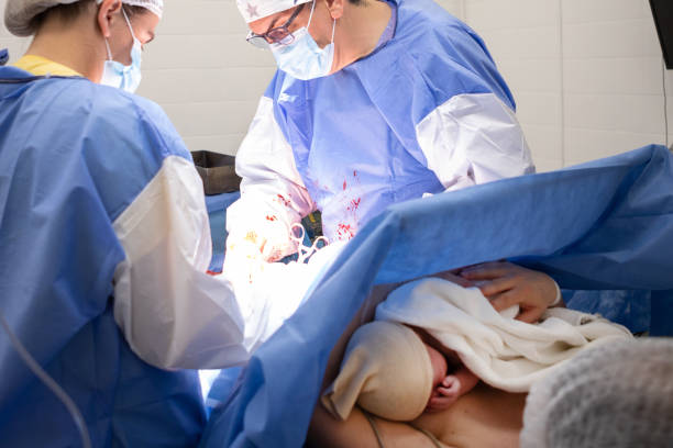 istock Mother and newborn daughter by cesarean section 1857941409