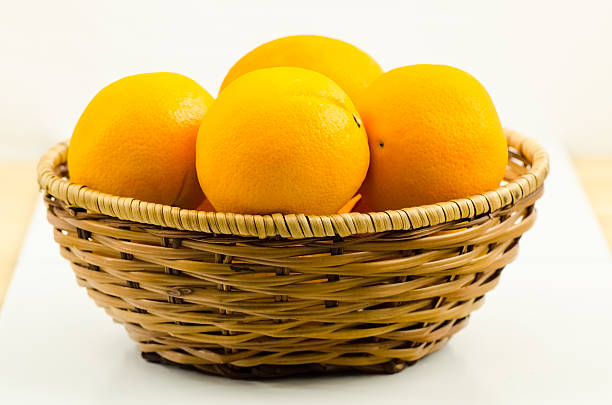 Orange in bastket stock photo