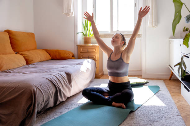 istock Woman exercising at home 1857977341