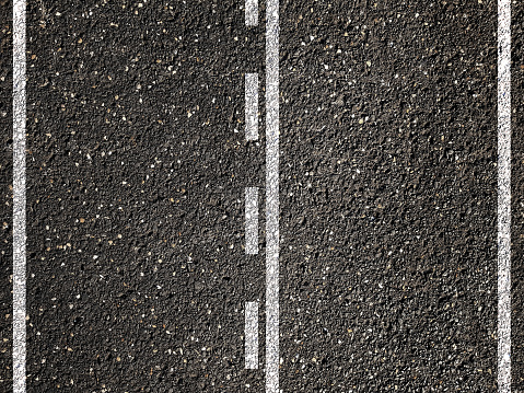 Dotted and solid double white lines on asphalt road