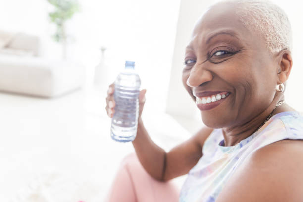 istock Senior Woman Drinking Water 1858028047